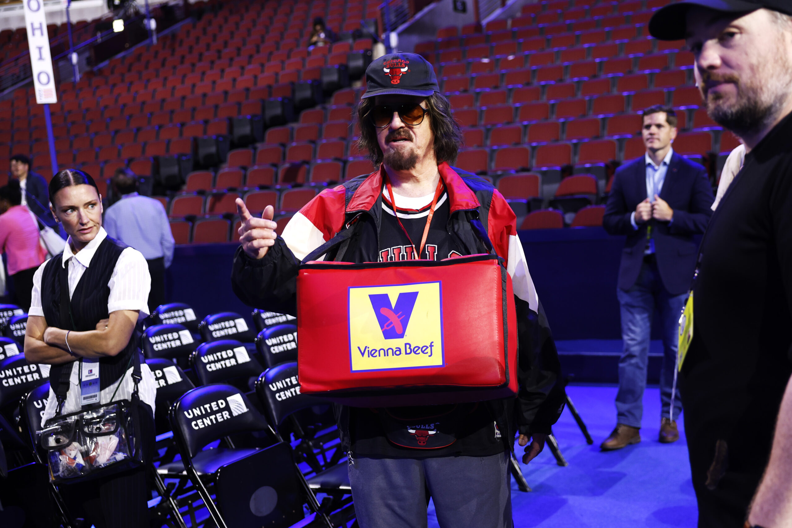 Stephen Colbert brings back his Donny Franks alter-ego — and gives a hot dog to AOC — at the DNC