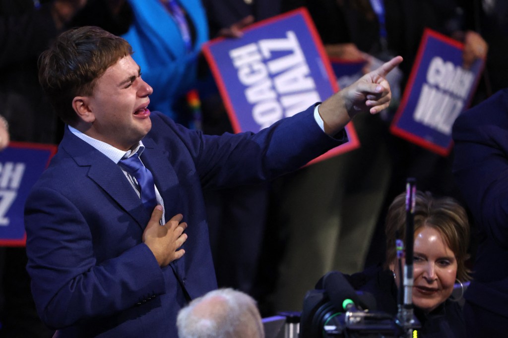 Gus Walz tearfully cheers on his father Tim as he accepts Democratic VP nomination: ‘That’s my dad!’