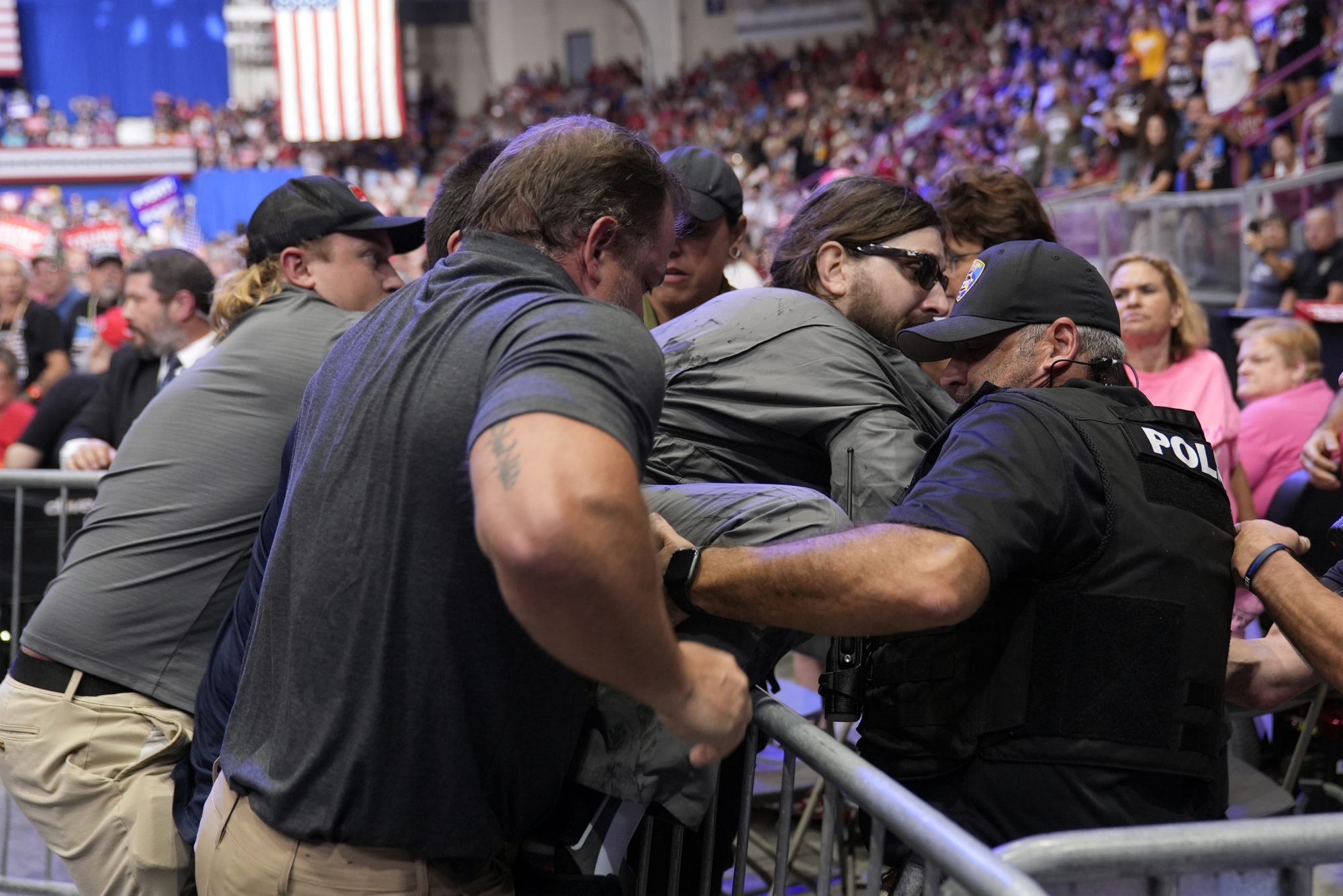 Trump rally disrupter will face charges after storming into press area