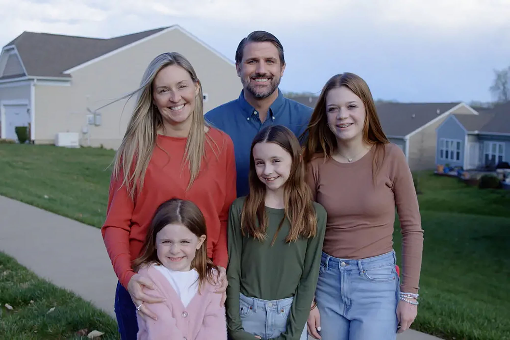 Congressional candidate goes viral after posing for ‘happy family’ pics — with friend’s wife and kids